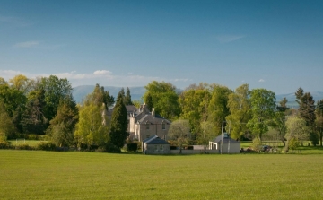 view of the house and surrounding grounds